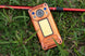 Orange Oukitel WP500 Ultra rugged smartphone displayed on grass
